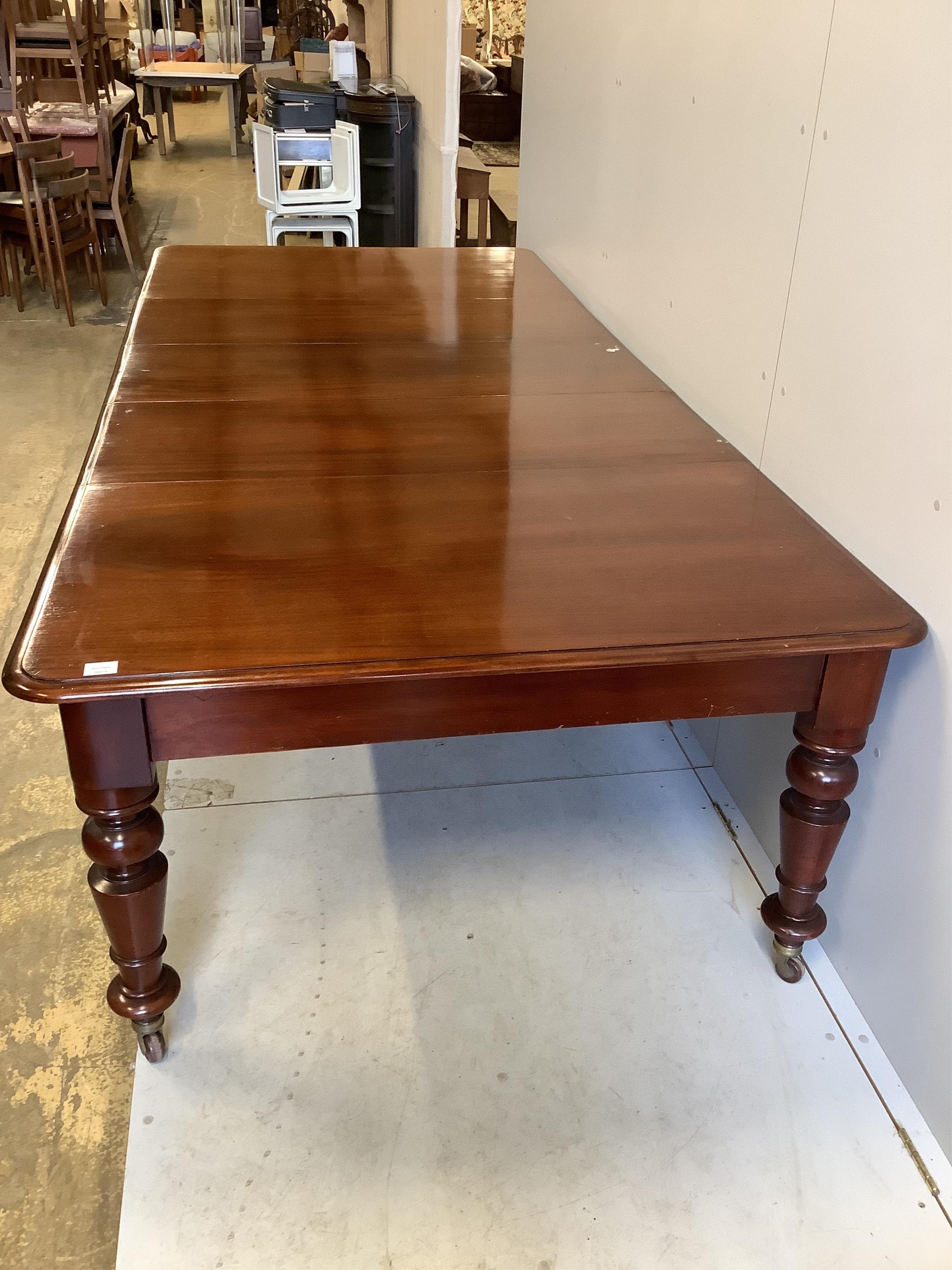 A Victorian rectangular mahogany extending dining table, 280cm extended, three spare leaves, depth 130cm, height 74cm. Condition - fair to good